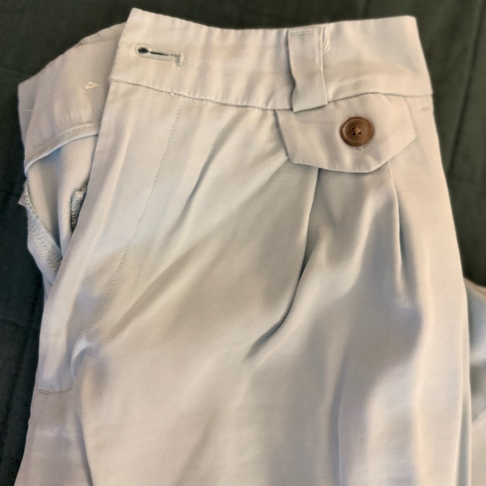 Light Blue Pleated Pants with Button Detail​